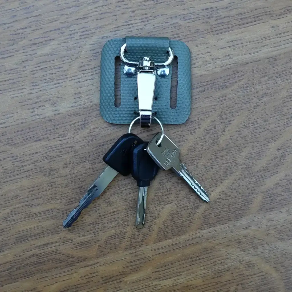 Porte-clés passant de ceinture en tuyau de lance à incendie upcyclé